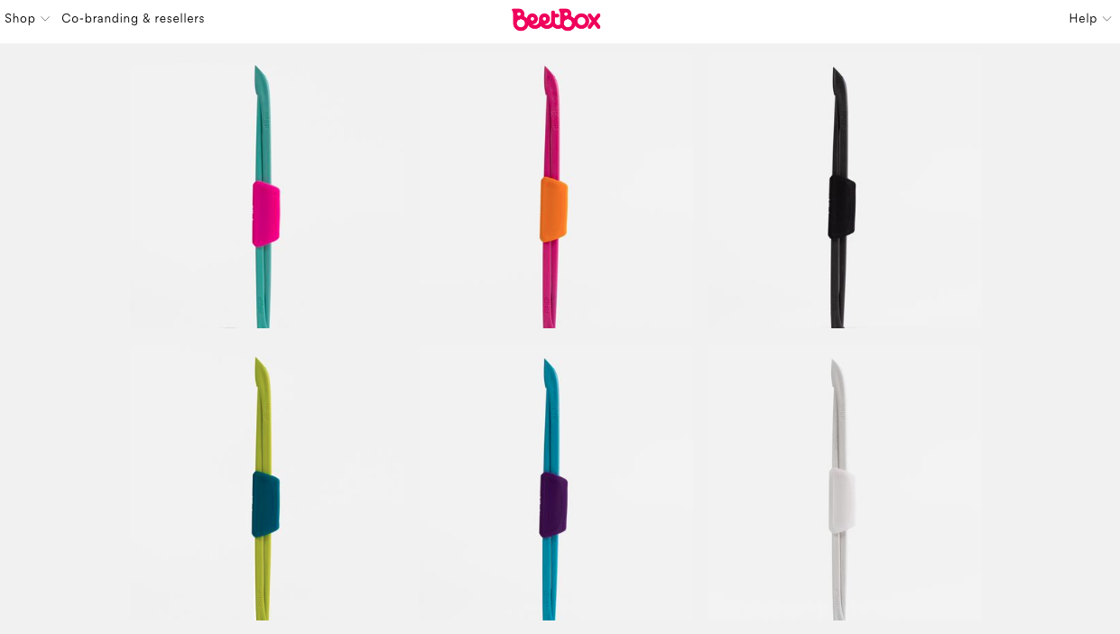 A collection of Dittoki chopsticks in 6 colour schemes: Bright teal hashi with screaming pink hashi-oki; magenta hashi with fruit orange hashi-oki; black on black hashi with hashi-oki; juice green hashi with teal hashi-oki; cyan hashi with plum purple hashi-oki and white on white hashi with hashi-oki.